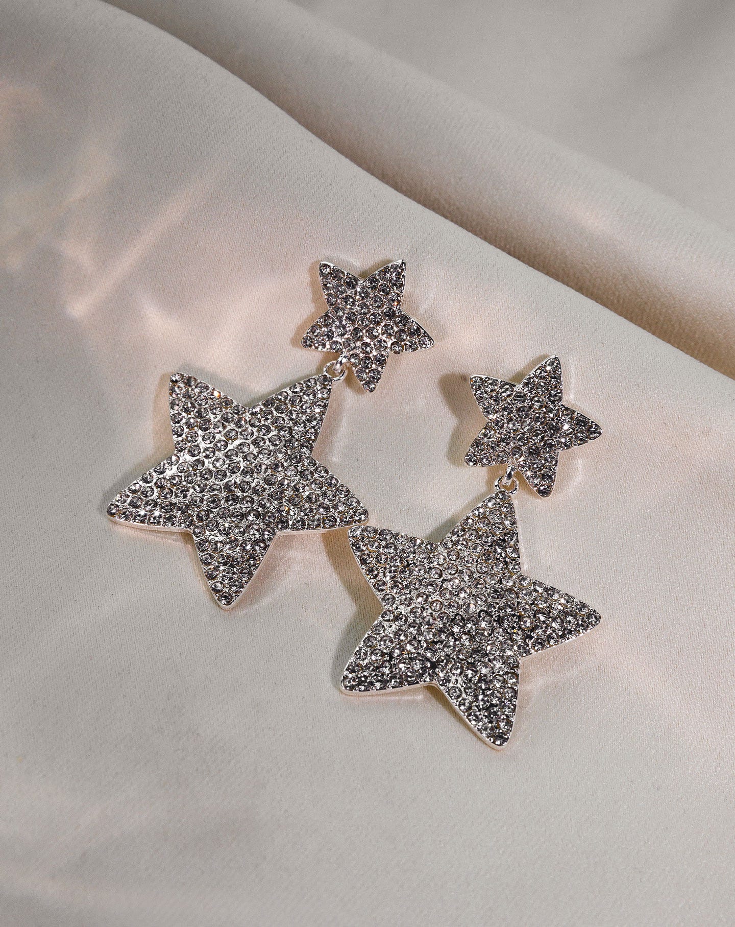 TWO STAR DIAMOND EARRINGS