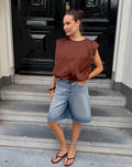 TYRA COTTON PADDED SHOULDER BUBBLE HEM TOP BRUIN