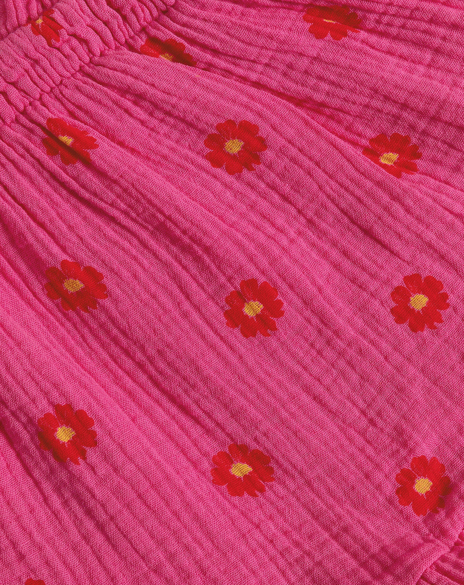 FLOWER MOUSSELINE ONE SLEEVE PLAYSUIT FUCHSIA