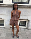 KIRA PEPLUM HALTER TOP BRUIN