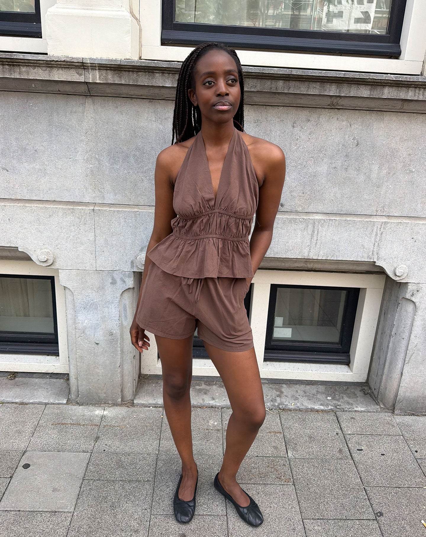 KIRA PEPLUM HALTER TOP BRUIN